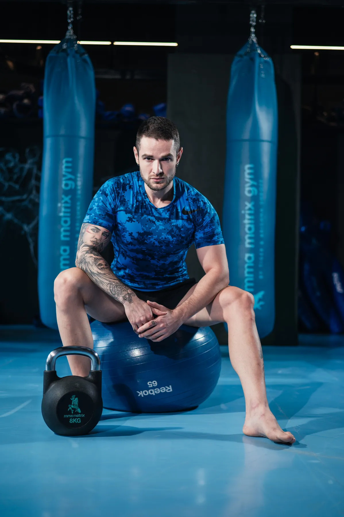 A certified MMA Matrix trainer in the branded bag room